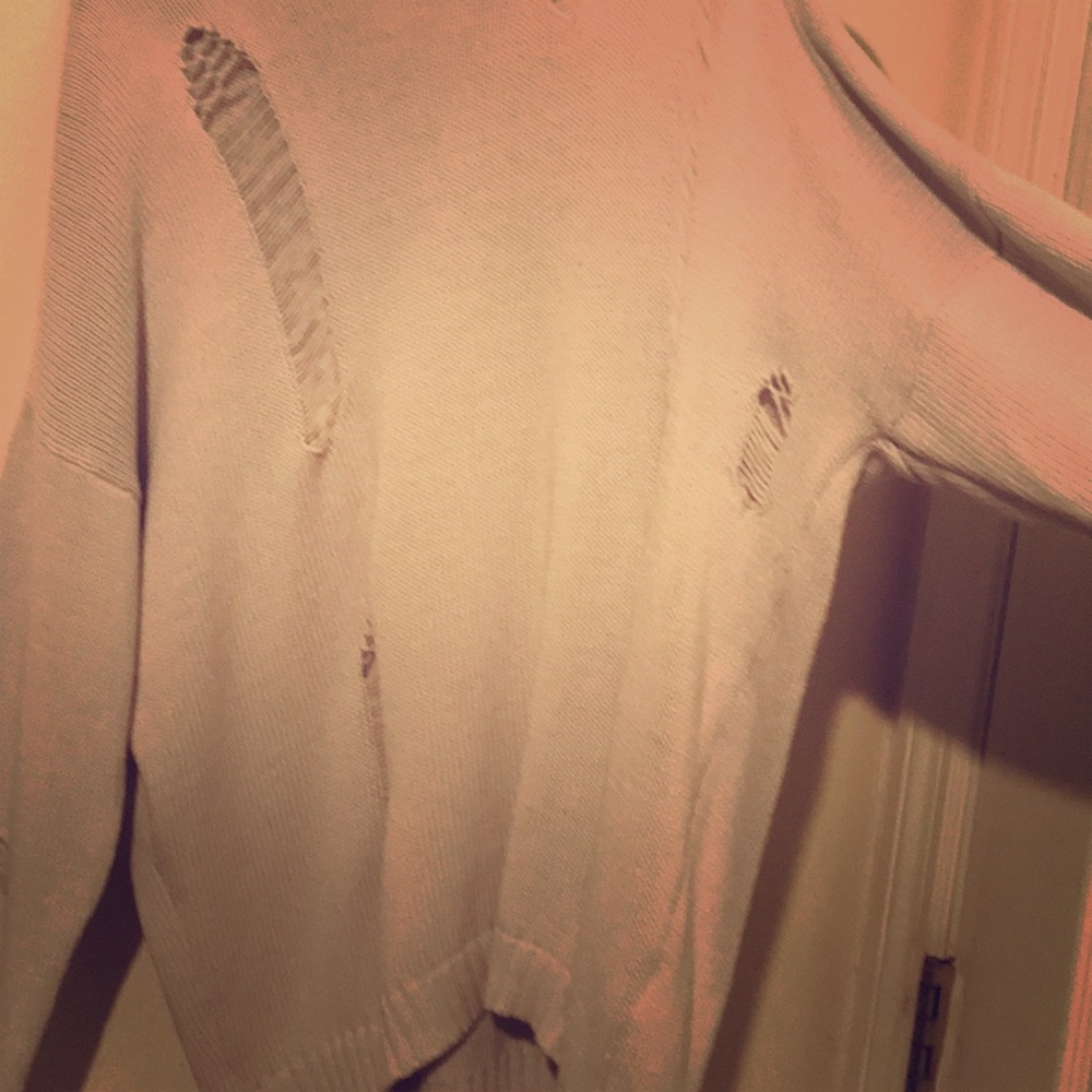 Medium sweater that is distressed . Never worn